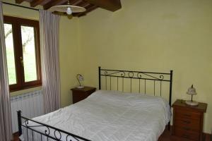 Postel nebo postele na pokoji v ubytování Agriturismo Le Ginestre