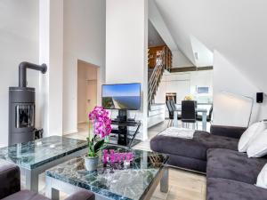 a living room with a couch and a table at Ferienhaus Rosa in Ostseebad Karlshagen