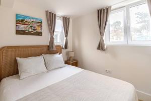 En eller flere senge i et værelse på Villa Margaritta