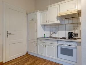 Kuchyň nebo kuchyňský kout v ubytování Villa Daheim - FeWo 03