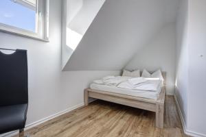 Postel nebo postele na pokoji v ubytování Haus Störtebeker