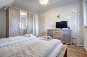 Postel nebo postele na pokoji v ubytování Haus Störtebeker