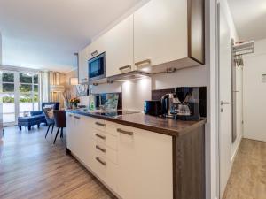Kuchyň nebo kuchyňský kout v ubytování Residenz am Balmer See - BS 06 mit Wellnessbereich