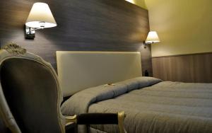 Postel nebo postele na pokoji v ubytování Hotel Est Piombino