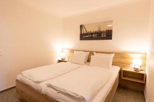 Ένα ή περισσότερα κρεβάτια σε δωμάτιο στο Cuxlandhotel Studio 121