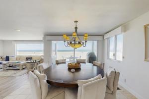 a dining room with a table and chairs at Savor the View in Oxnard