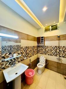 a bathroom with a sink and a toilet at Luxury kanal portion in Islamabad in Islamabad