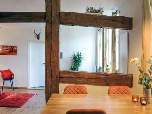 a dining room with a wooden table and chairs at Apartment Georg by Interhome in Mirow