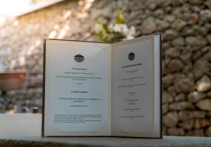 a book sitting on top of a table at Locanda Gaudemus Boutique Hotel in Sistiana