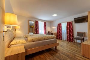 Postel nebo postele na pokoji v ubytování Albergo Lardi