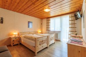 Postel nebo postele na pokoji v ubytování Albergo Lardi