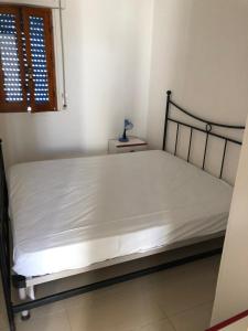 A bed or beds in a room at Dependence Valle Clavia
