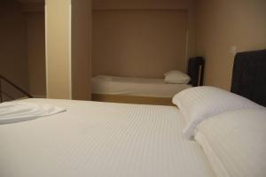 Postel nebo postele na pokoji v ubytování Pampas Duplex Rooms