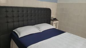 Llit o llits en una habitació de Kitnet 17c
