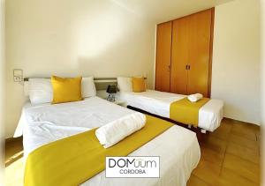 Posteľ alebo postele v izbe v ubytovaní DOMuum Holidays - CORDOBA Apartments