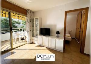 Televízia a/alebo spoločenská miestnosť v ubytovaní DOMuum Holidays - CORDOBA Apartments