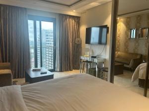 Ένα ή περισσότερα κρεβάτια σε δωμάτιο στο Studio,atMirage +21 φωτογραφίες