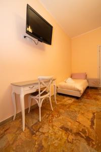 TV in/ali zabaviščno središče v nastanitvi Apulia Concept B&B