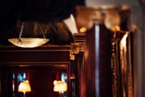 a close up of a mirror and a pendulum sidx sidx at Maison Athénée in Paris +49 photos