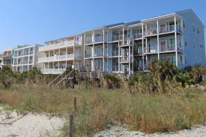 a large apartment building on the beach at Host on the Coast in Folly Beach