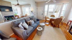 a living room with a couch and a table at Host on the Coast in Folly Beach