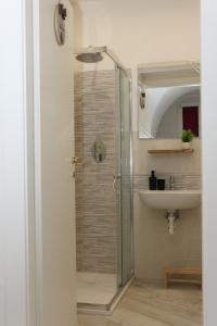 a bathroom with a shower and a sink at Il Viandante Bed & Breakfast in Roseto Valfortore +79 photos