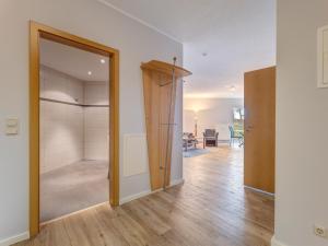 an empty room with a closet and a door at Haus Berlin, Wohnung 2 in Loddin