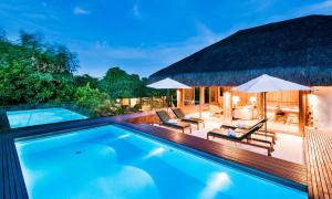 a villa with a swimming pool and a resort at Tivoli Ecoresort Praia do Forte in Praia do Forte