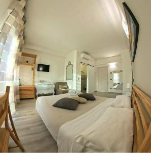 Posteľ alebo postele v izbe v ubytovaní ATTICO LIVORNO Bed & Relax