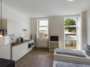 Η κουζίνα ή μικρή κουζίνα στο Modernes Studio Apartment mit Balkon