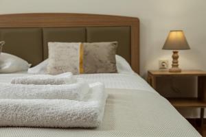 A bed or beds in a room at Vasiliki house