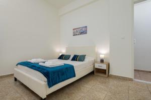 A bed or beds in a room at Vasiliki house