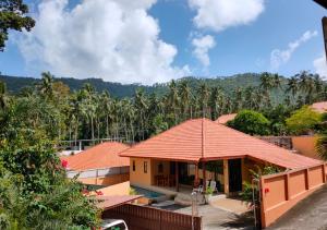 a view of a house with a roof at 3 bedroom villa with swimming pool Lamai in Nathon Bay