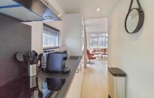 a kitchen with a sink and a counter top at 2 Bedroom Amazing Home In Hellendoorn in Hellendoorn