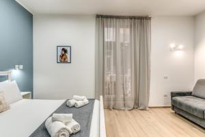 Letto o letti in una camera di Caravita Rooms
