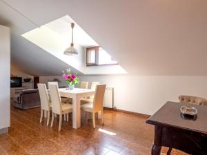 a dining room with a table and chairs at Apartment Ca' D'Gnese by Interhome in Castagnole Lanze +13 photos