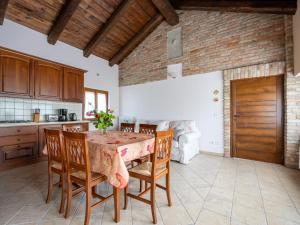a kitchen with a table and chairs in a room at Holiday Home Antica Cascina by Interhome in Castagnole Lanze +18 photos