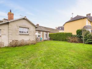 a house with a yard in front of it at Holiday Home La Floriette by Interhome in Dinard