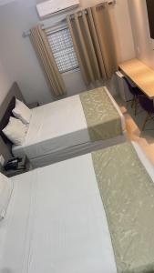 Postel nebo postele na pokoji v ubytování Hotel Uipi