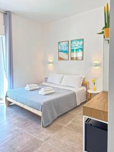 Postel nebo postele na pokoji v ubytování NEMO BnB ALGHERO CENTRE