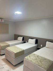 Postel nebo postele na pokoji v ubytování Hotel Uipi