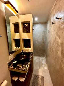 a bathroom with a sink and a counter top at Apartamento nuevo en zona romántica a 3 cuadras de la playa in Puerto Vallarta