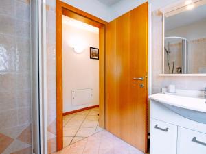 a bathroom with a shower and a sink and a mirror at Apartment Stabler by Interhome in Pera +34 photos