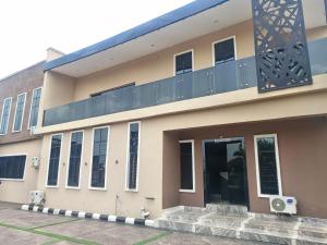 a building with a balcony on top of it at Ja'Oak Hotel and Suites in Benin City