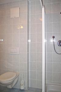 a bathroom with a toilet and a shower at Apartment Nebenhaus Schönblick - SVH112 by Interhome in San Valentino alla Muta +25 photos