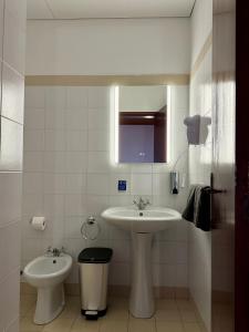 Koupelna v ubytování Habitación con estacionamiento