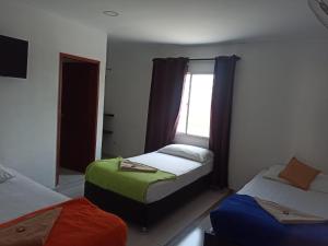 Hotel Don Jose客房内的一张或多张床位