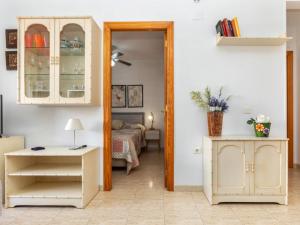 a room with a bedroom with a bed and a mirror at Apartment Portofino IV by Interhome in Oropesa del Mar