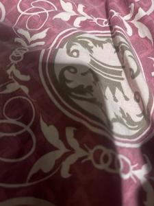 a close up of a pillow with a design on it at Tkp in Ban Map Pla Khao