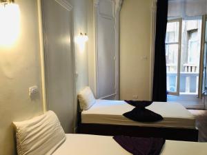 Llit o llits en una habitació de Mesho Cairo Hostel
